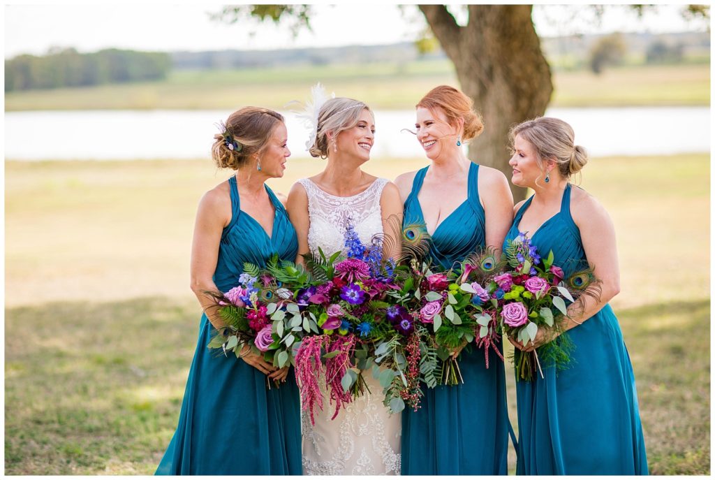 The Bride and her bridesmaids | Peacock themed wedding at Emery's Buffalo Creek 