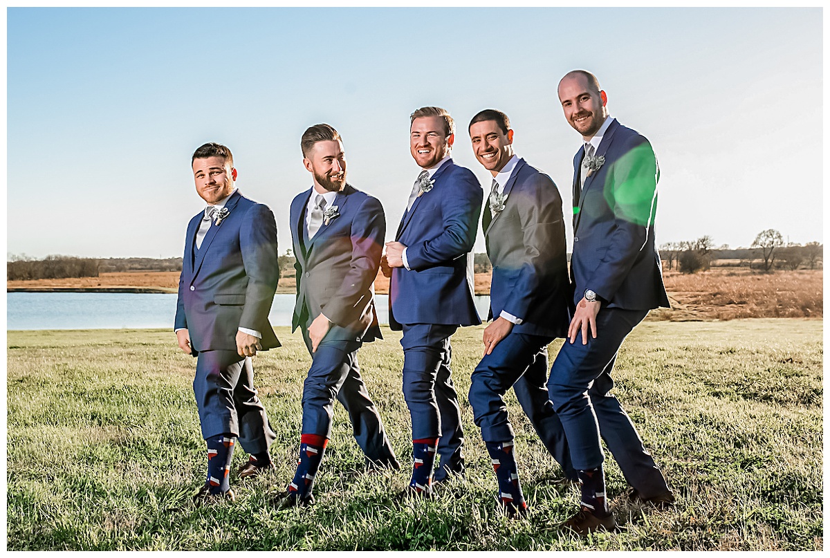 Houston Winery Wedding Venue | Groomsmen Lakefront pose at Emery's Buffalo Creek 