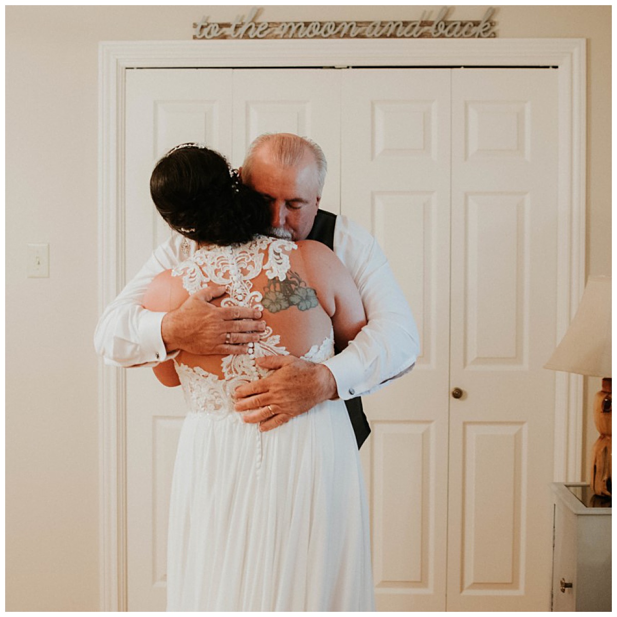Bride and her father sharing a hug before her wedding day at Emery's Buffalo Creek | Ocean blue inspired wedding