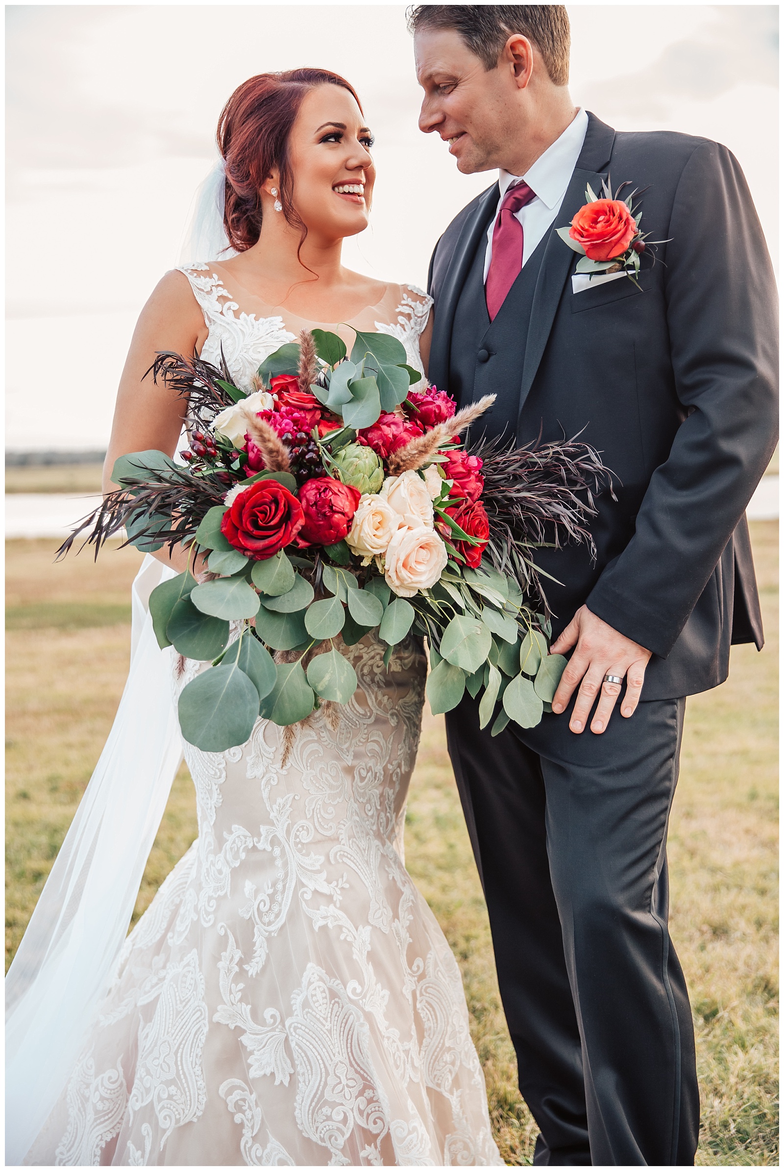Glam Burgundy and Blush Wedding | Couple and beautiful bridal bouquet at Emery's Buffalo Creek