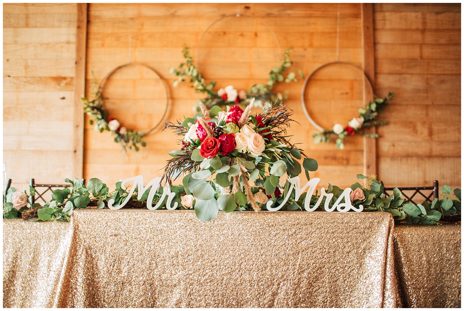 Head table and backdrop | Glam Burgundy and Blush Wedding at Emery's Buffalo Creek 