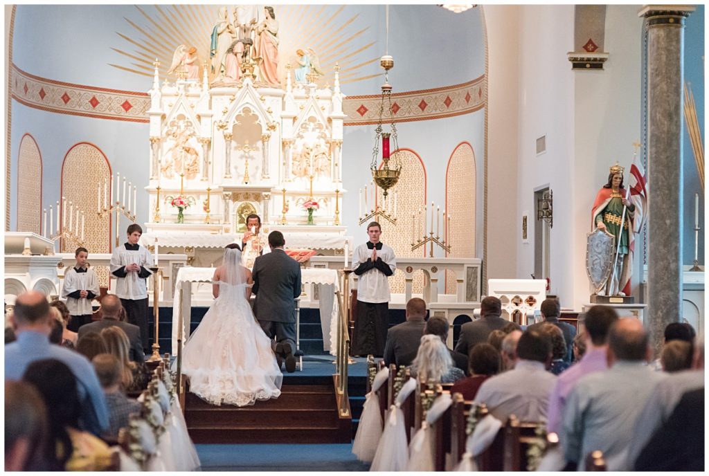 Catholic Ceremony at Holy Cross Church with following reception at Emery's Buffalo Creek | Yellow Farmhouse style Wedding