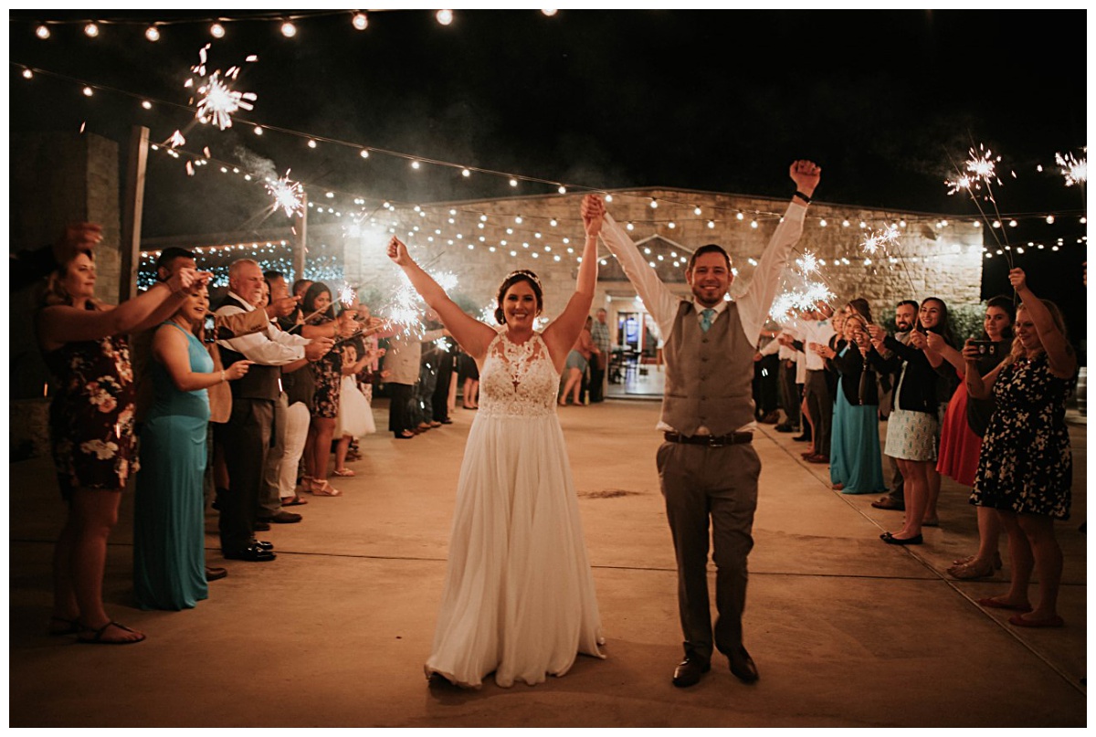 Sparkler exit on the Firefly Terrace | Ocean Blue wedding at Emery's Buffalo Creek 