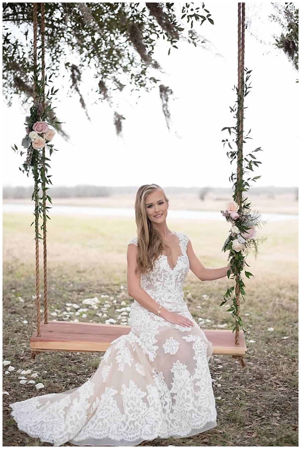 Bride on Emery's Swing at Texas wedding venue in Bellville, TX 