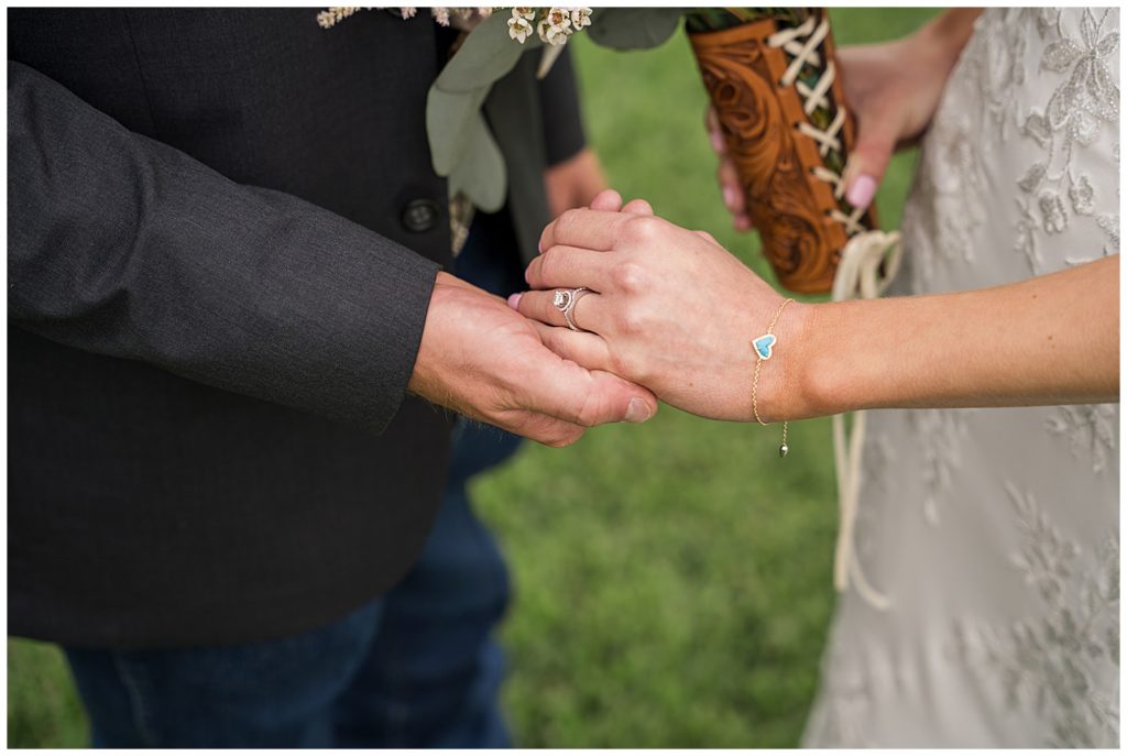 Bride and  Groom holding hands after the ceremony at Emery's Buffalo Creek 
