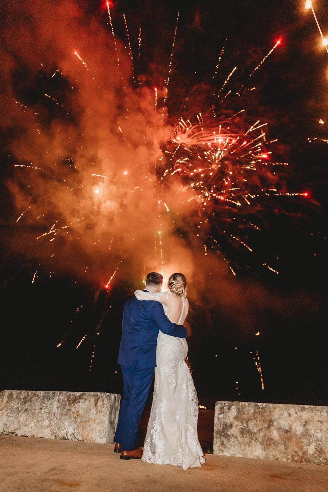 Photo of Emery's Buffalo Creek Couple enjoying a fireworks show after Texas Summer Wedding