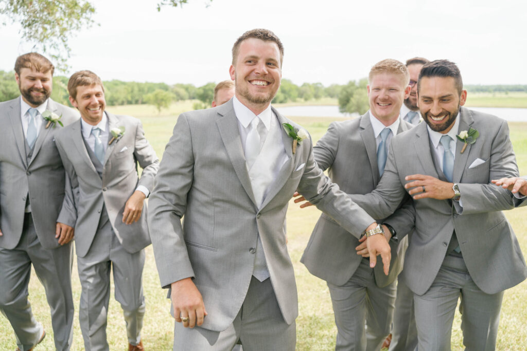 Photo of groomsmen at a Texas Summer wedding at Emery's Buffalo Creek